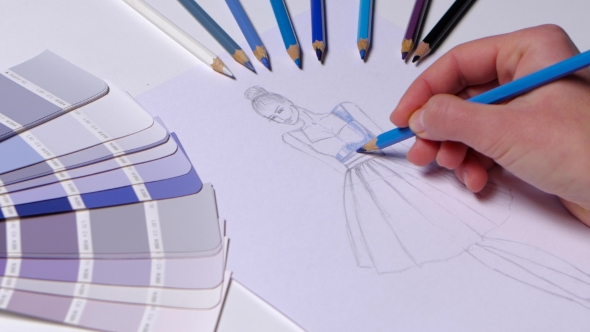 590x332 Designer Dress Decorates A Sketch In Blue, On A Table Cloth - Table Cloth Sketch